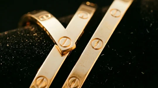 Detailed examination of Cartier Love bracelet authenticity markers and screw alignment