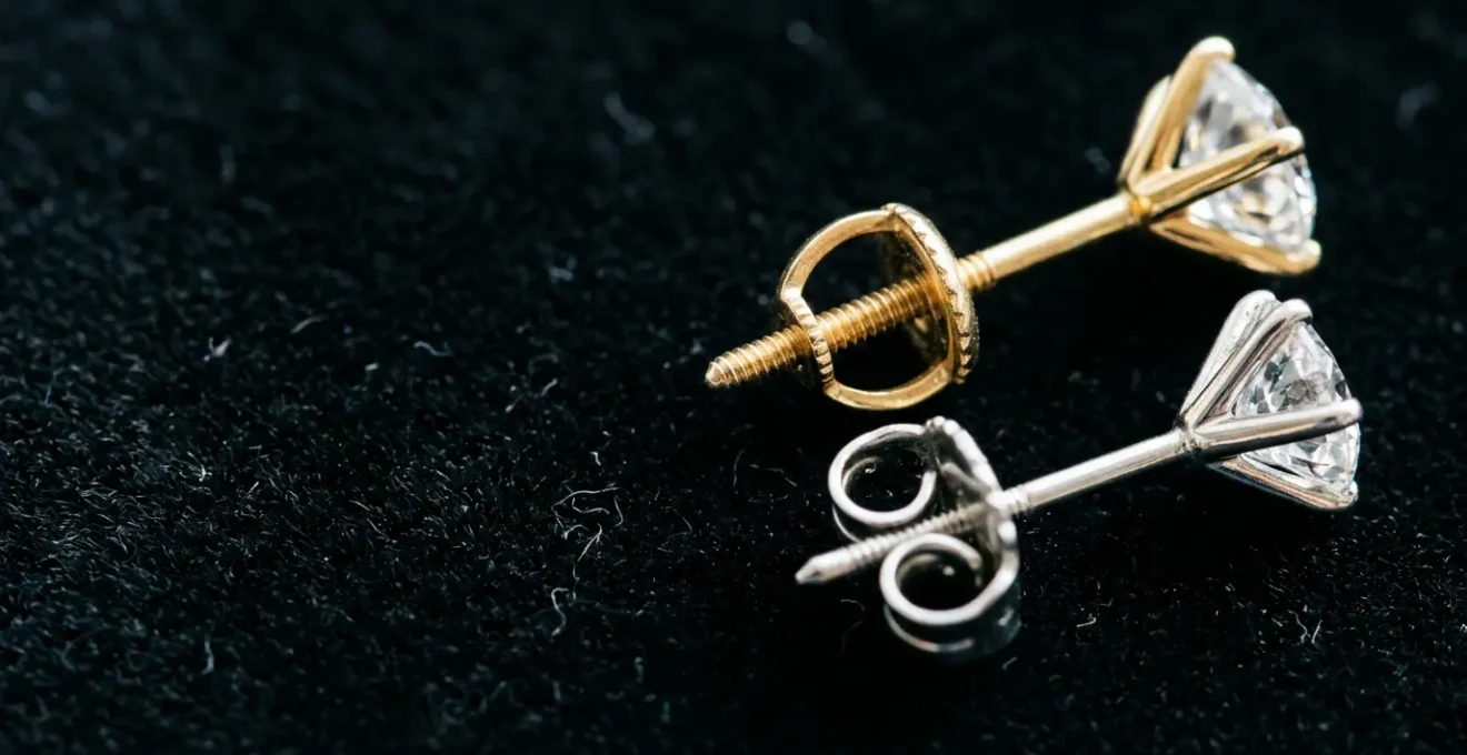 Professional comparison of screw back and butterfly back systems on diamond stud earrings showcasing security features