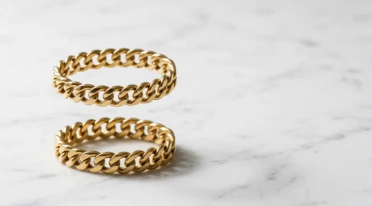 Professional comparison of hollow and solid gold bracelets showing weight difference and craftsmanship details