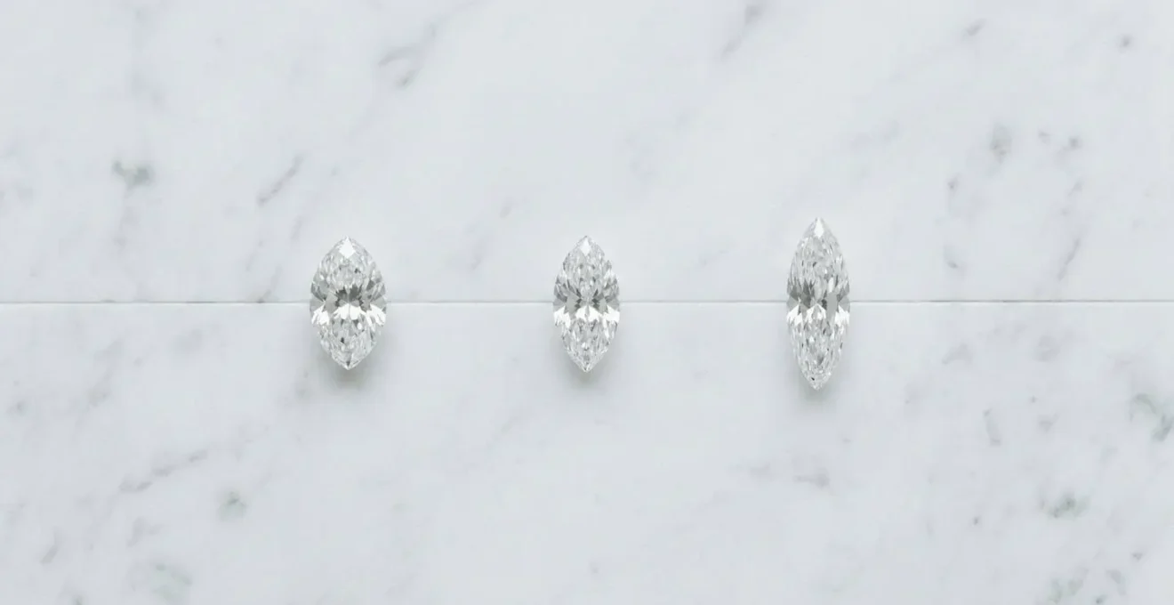 Three marquise diamonds showing different length-to-width ratios from stocky to slender