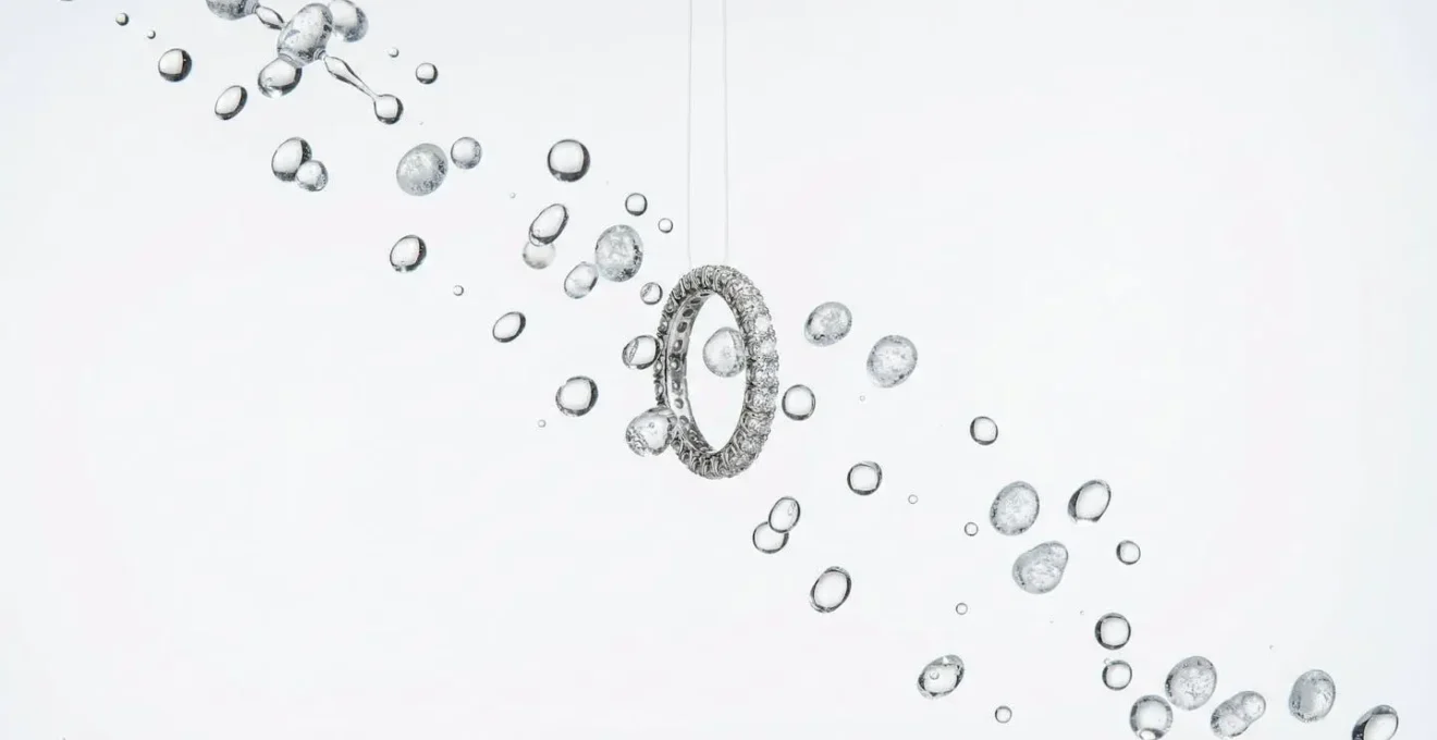 Pavé diamond ring with water droplets being dried with cool air