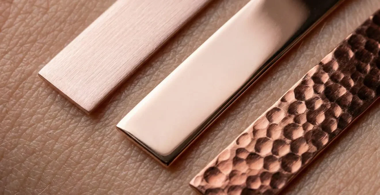 Different rose gold alloy shades from blush pink to copper-red against various pale skin tones to show contrast.